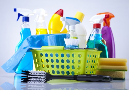 Cleaner wearing protective gloves during a safety-focused cleaning task